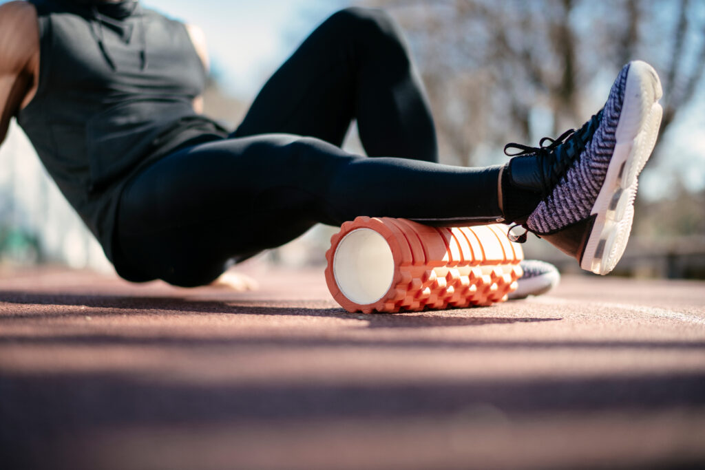 Man,Foam,Rolling.,Athlete,Stretches,Using,Foam,Roller.